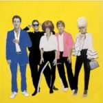 Five people pose against a bright yellow background, rocking bold, contrasting outfits and exaggerated hairstyles, channeling the iconic style of GEORGE DUBOSE - B-52s with their confident expressions.